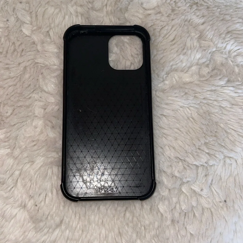 iPhone 12 phone cover preowned but hardily used perfect condition black cover